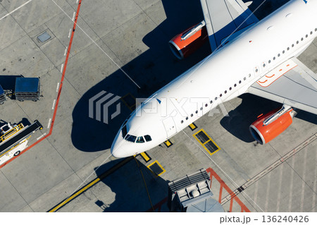 Aerial view of airplane at airport Aerial view of airplane at airport 136240426