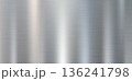 Curved brushed silver metal surface with horizontal lines 136241798