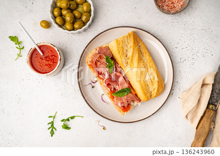 Baguette sandwich with prosciutto or jamon 136243960
