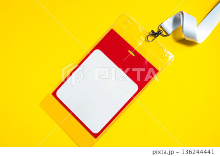 Event badge mockup with blank space for personal data, hanging on a white ribbon. Clean and modern design, suitable for office, conference, or seminar identification themes. Free copy space for design 136244441