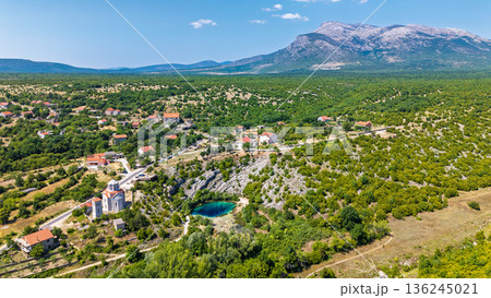Iconic Eye of the Earth spring karst sinkhole source of Cetina River Croatia aerial view Iconic Eye of the Earth spring karst sinkhole source of Cetina River Croatia aerial view 136245021
