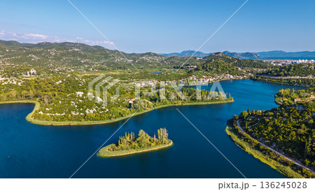 Aerial view of Bacina Lakes freshwater lagoon system surrounded by green hills in Dalmatia Croatia Aerial view of Bacina Lakes freshwater lagoon system surrounded by green hills in Dalmatia Croatia 136245028