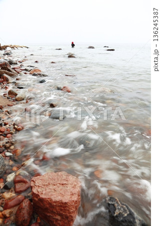 Fisherman Stones in sea water autumn 136245387