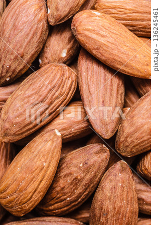Peeled almonds closeup as background 136245461