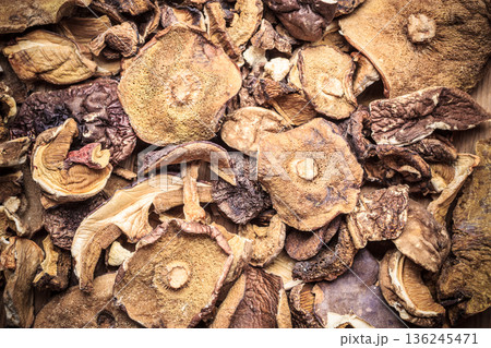 Dry mushrooms as food background Dry mushrooms as food background 136245471