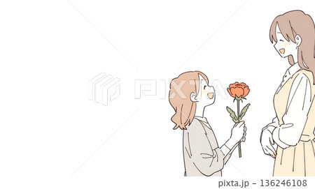 母の日のプレゼントでカーネーションの花を渡す子供 136246108