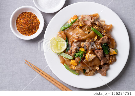 Thai food (Pad See Ew), Stir-fried rice noodles with soy sauce, pork, egg, and kale 136254751