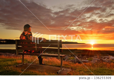 Man Sitting Watching A Wonderful Summer Sunset Foxton Beach New Zealand Man Sitting Watching A Wonderful Summer Sunset Foxton Beach New Zealand 136255309