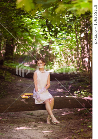 moscow, russia,07.07.2022 A young Caucasian woman with brown hair moscow, russia,07.07.2022 A young Caucasian woman with brown hair 136255318