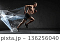 Young woman dancing with fitness and fashion flair as a beauty model performs an aerobic jump motion in a studio pose 136256040