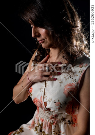 Emotional singer in serene setting, Intimate studio shot reveals deep emotional introspection, Portrait of singer in quiet moment with subtle tears and calm expression 136260935