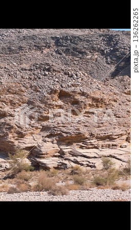 Sunbaked Bench Reveals Natural Patterns. Desert Landscape Features Terraced Erosional Formations. Weathered Land With Stepped Formations Exhibits Warm Earth Tones And Textures Sunbaked Bench Reveals Natural Patterns. Desert Landscape Features Terraced Erosional Formations. Weathered Land With Stepped Formations Exhibits Warm Earth Tones And Textures 136262265