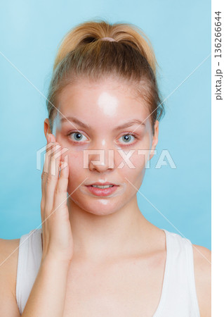 Woman in facial peel off mask. Woman in facial peel off mask. 136266644
