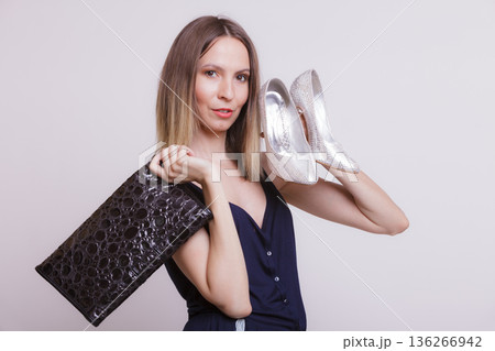 Fashion woman with leather handbag and high heels. Fashion woman with leather handbag and high heels. 136266942