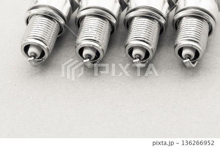 Auto service. Set of spark plugs as spare part of car. Auto service. Set of spark plugs as spare part of car. 136266952