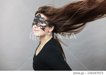 Mysterious woman wearing lace mask Mysterious woman wearing lace mask 136267073