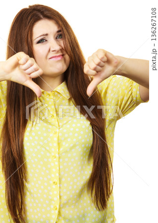 Woman showing thumb down gesture 136267108