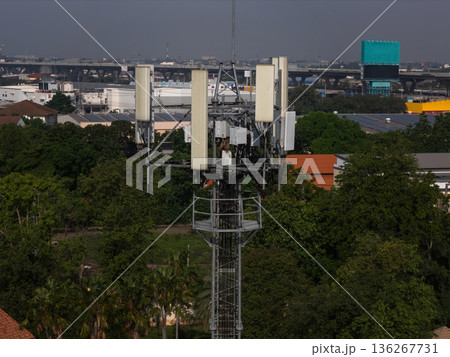 Communication tower top. Radio antenna Tower , microwave antenna tower on light sky background. Communication tower top. Radio antenna Tower , microwave antenna tower on light sky background. 136267731