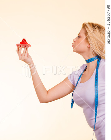 Woman holding strawberry sweet cupcake 136267799
