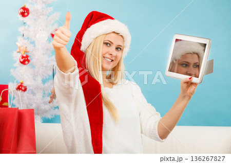 Girl with tablet credit card doing online shopping 136267827