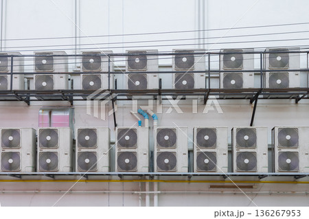 Air conditioner compressor installed in old building.  136267953