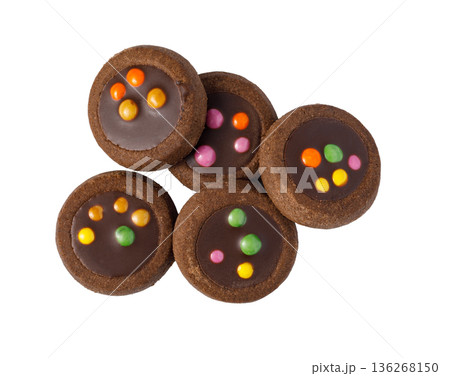 Chocolate cookies with colorful candy pieces isolated Chocolate cookies with colorful candy pieces isolated 136268150