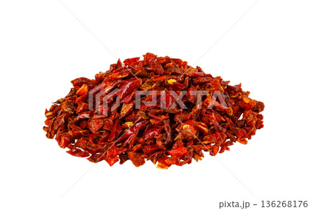 Dried red chili flakes pile on white background 136268176