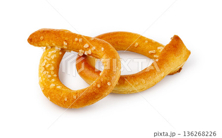 Baked pretzel snack topped with coarse salt 136268226
