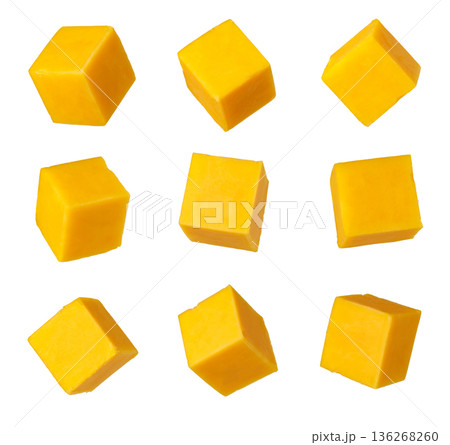 Cheddar cheese cubes falling isolated on white background Cheddar cheese cubes falling isolated on white background 136268260