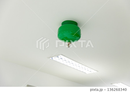 Automated Fire Extinguisher set in building.  136268340