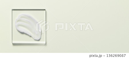 White cosmetic skin care product on glass. Copy space White cosmetic skin care product on glass. Copy space 136269087