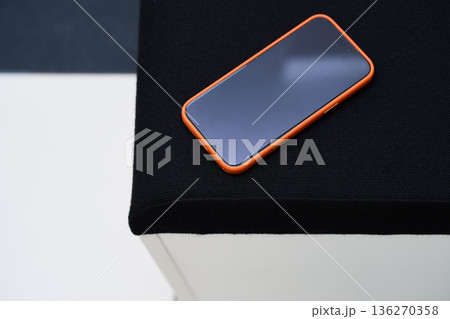Smartphone on Black Surface - Modern Technology Shot 136270358