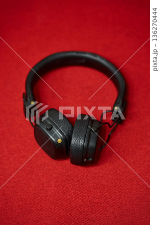 Black Headphones on Red Background 136270444