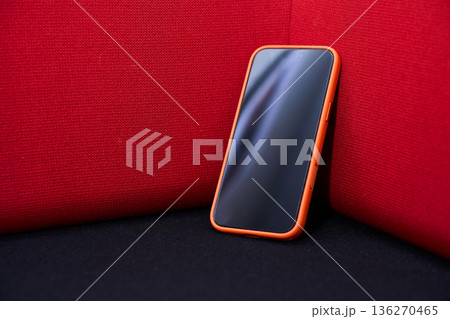 Smartphone on Red Background - Modern Technology Concept Smartphone on Red Background - Modern Technology Concept 136270465