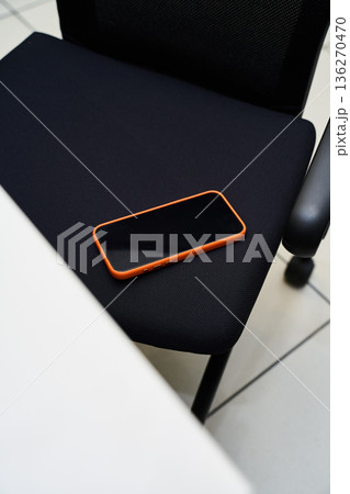 Smartphone on Office Chair - Modern Workspace Concept Smartphone on Office Chair - Modern Workspace Concept 136270470