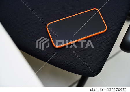 Smartphone on Dark Fabric - Modern Technology Smartphone on Dark Fabric - Modern Technology 136270472