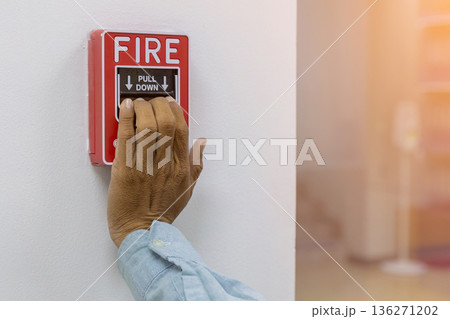 Activate fire alarm trigger system which is installed on granite wall of the building. Activate fire alarm trigger system which is installed on granite wall of the building. 136271202