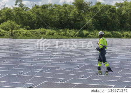 Engineer Checking and working setup Floating solar panels or solar cell Platform system on the lake.  136271372