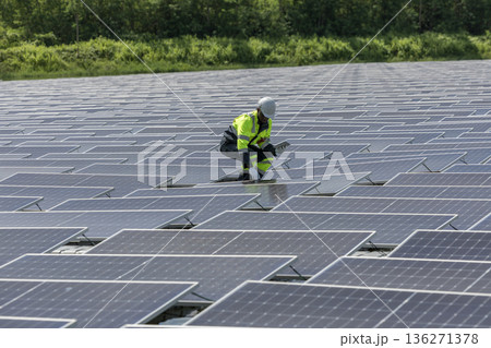 Engineer Checking and working setup Floating solar panels or solar cell Platform system on the lake. Engineer Checking and working setup Floating solar panels or solar cell Platform system on the lake. 136271378