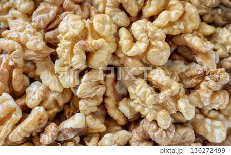 Photo of natural, freshly shelled walnuts, selective focus. Photo of natural, freshly shelled walnuts, selective focus. 136272499