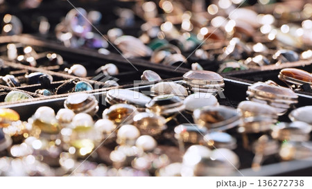 Handcrafted rings with natural gemstones displayed for sale in an Indian market Handcrafted rings with natural gemstones displayed for sale in an Indian market 136272738