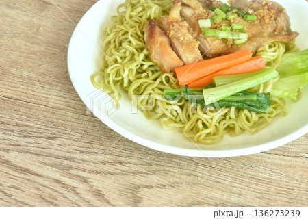 Chinese vegetable noodles slice grilled chicken with Teriyaki Japanese sauce and cabbage on plate Chinese vegetable noodles slice grilled chicken with Teriyaki Japanese sauce and cabbage on plate 136273239