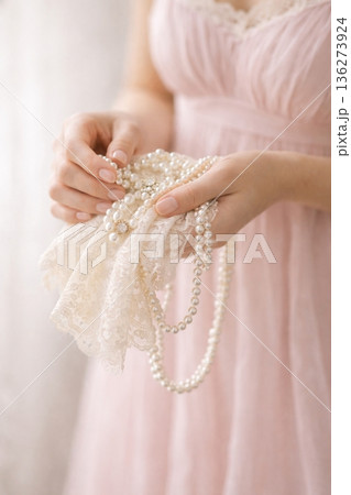 Elegant Woman in Lavender Dress Handling Pearl Jewelry and Lace Elegant Woman in Lavender Dress Handling Pearl Jewelry and Lace 136273924