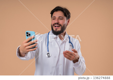 Male Doctor Providing Online Medical Consultation Video Call, remote telehealth 136274888