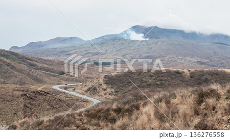 Top view of curve road to mount Aso volcano with eruption, Kumamoto 136276558