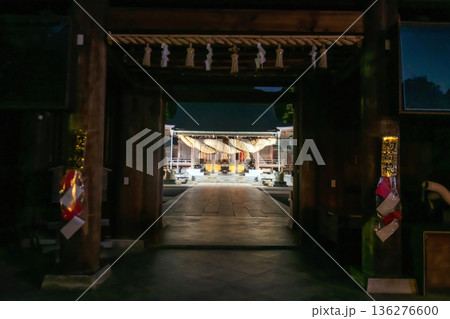 Entrance gate to Miyajidake Shrine with sacred rope at night 136276600