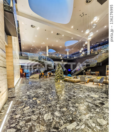 Luxurious lobby of the Clarion Congress Hotel in Ostrava, decorated for Christmas with a large tree. 136276995