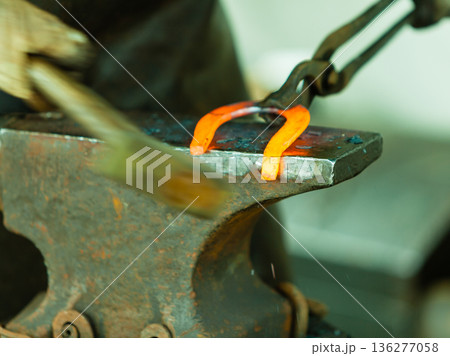 Hammering glowing steel - to strike while the iron is hot. Hammering glowing steel - to strike while the iron is hot. 136277058