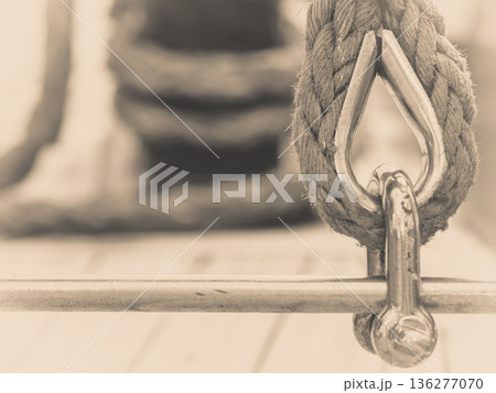 Old fashioned harbor marina sailboat ropes Old fashioned harbor marina sailboat ropes 136277070