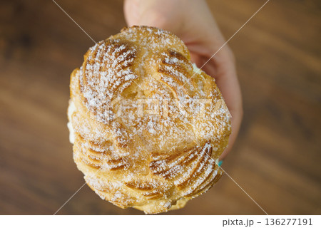 Woman hand holding sweet bun 136277191